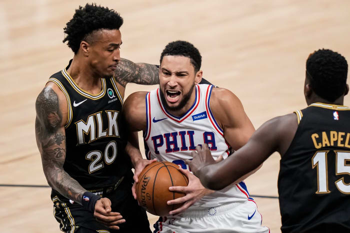 Jun 18, 2021; Atlanta, Georgia, USA; Philadelphia 76ers guard Ben Simmons (25) drives to the basket against Atlanta Hawks forward John Collins (20) during the first half in game six in the second round of the 2021 NBA Playoffs. at State Farm Arena.